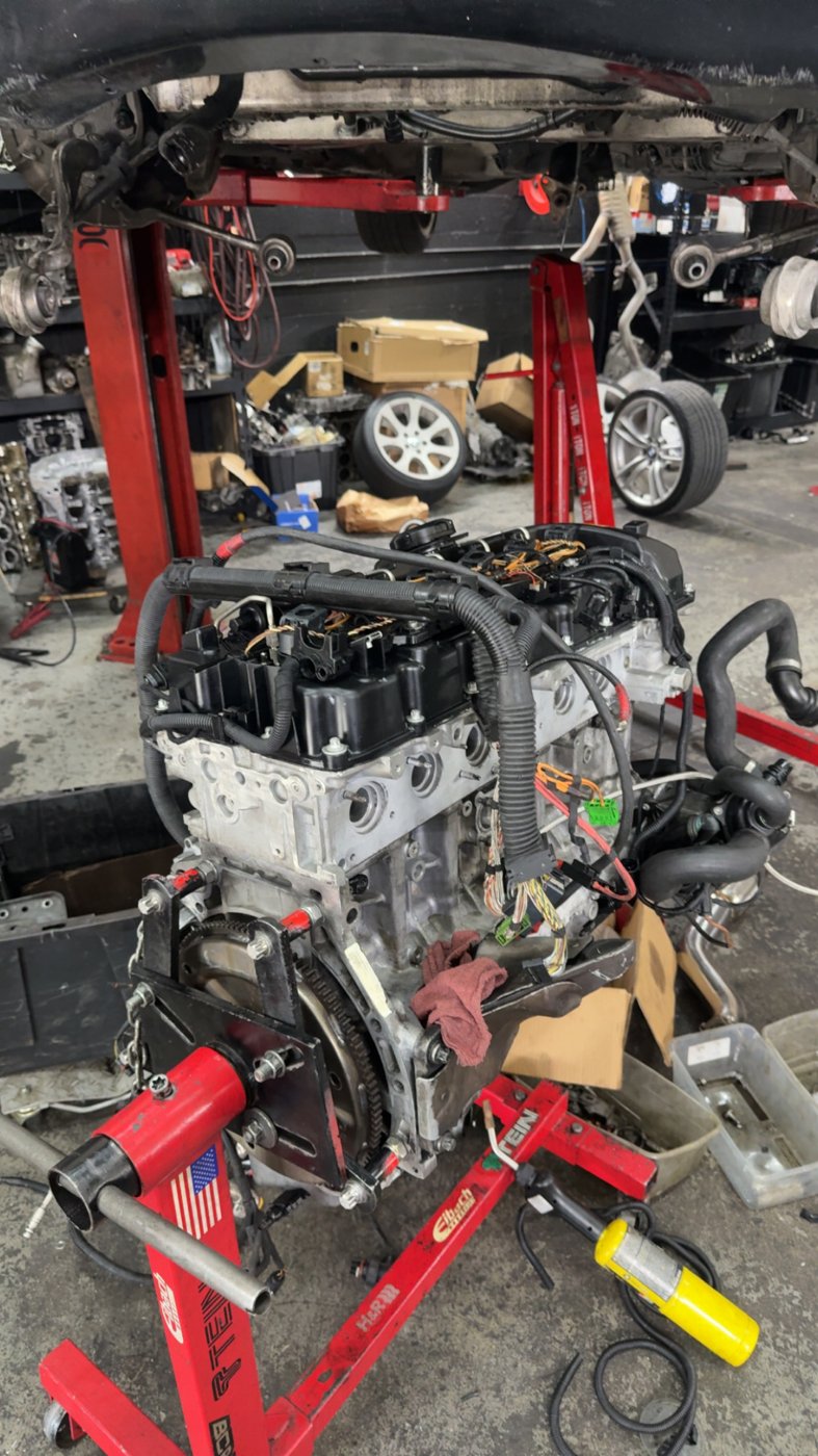 BMW engine on a stand in the garage