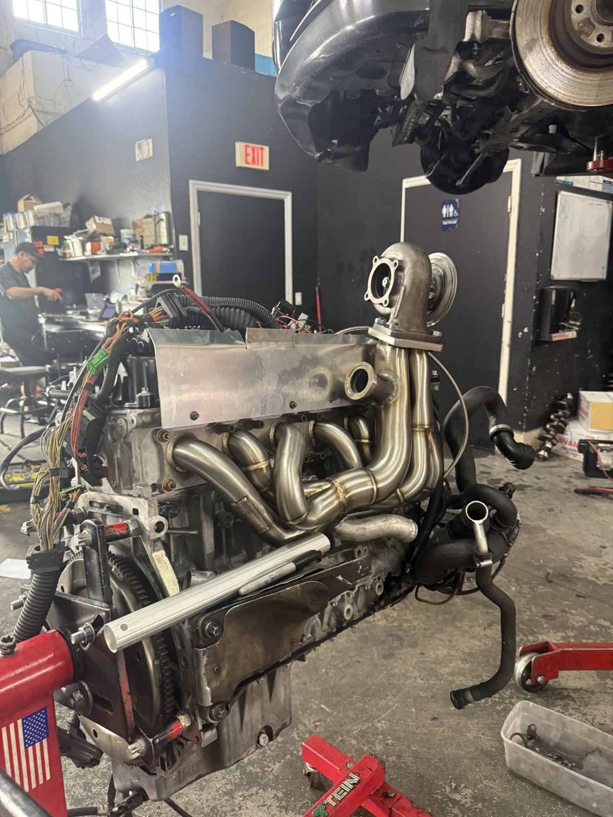 BMW engine out of the car on an engine stand