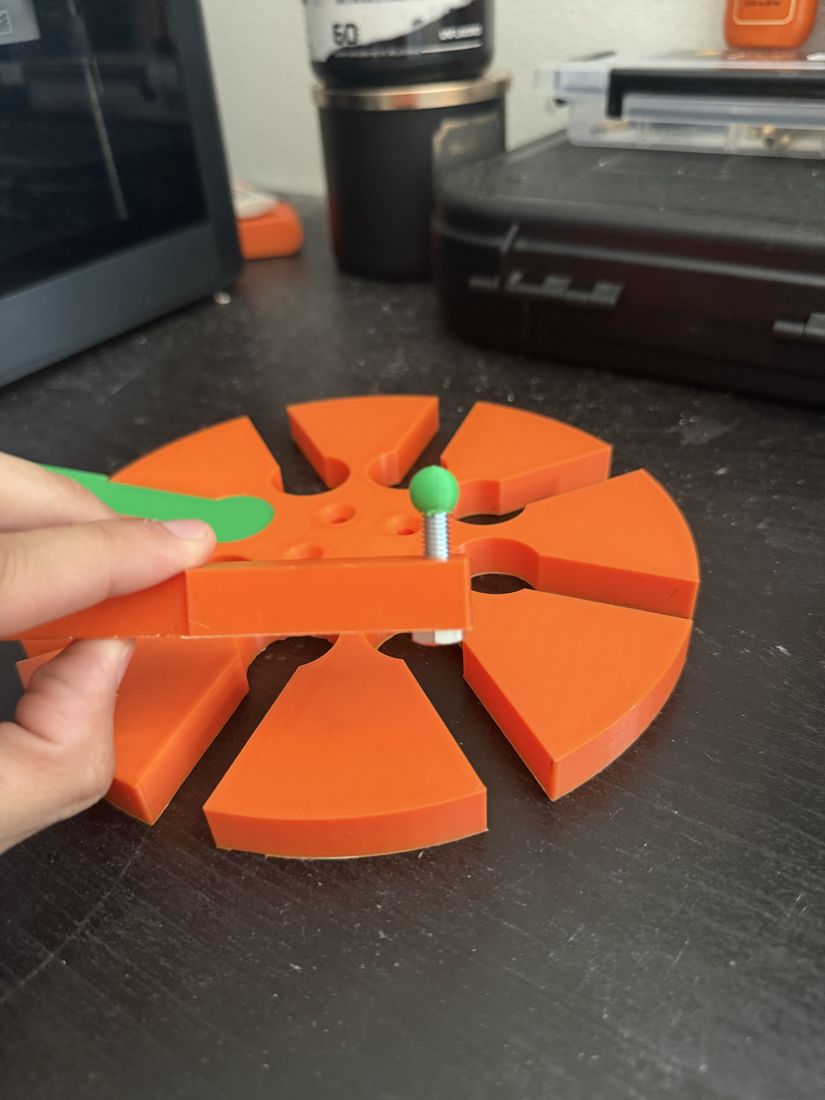 Printed V1 pinwheel hub with an arm test-fit into one of the eight slotted positions