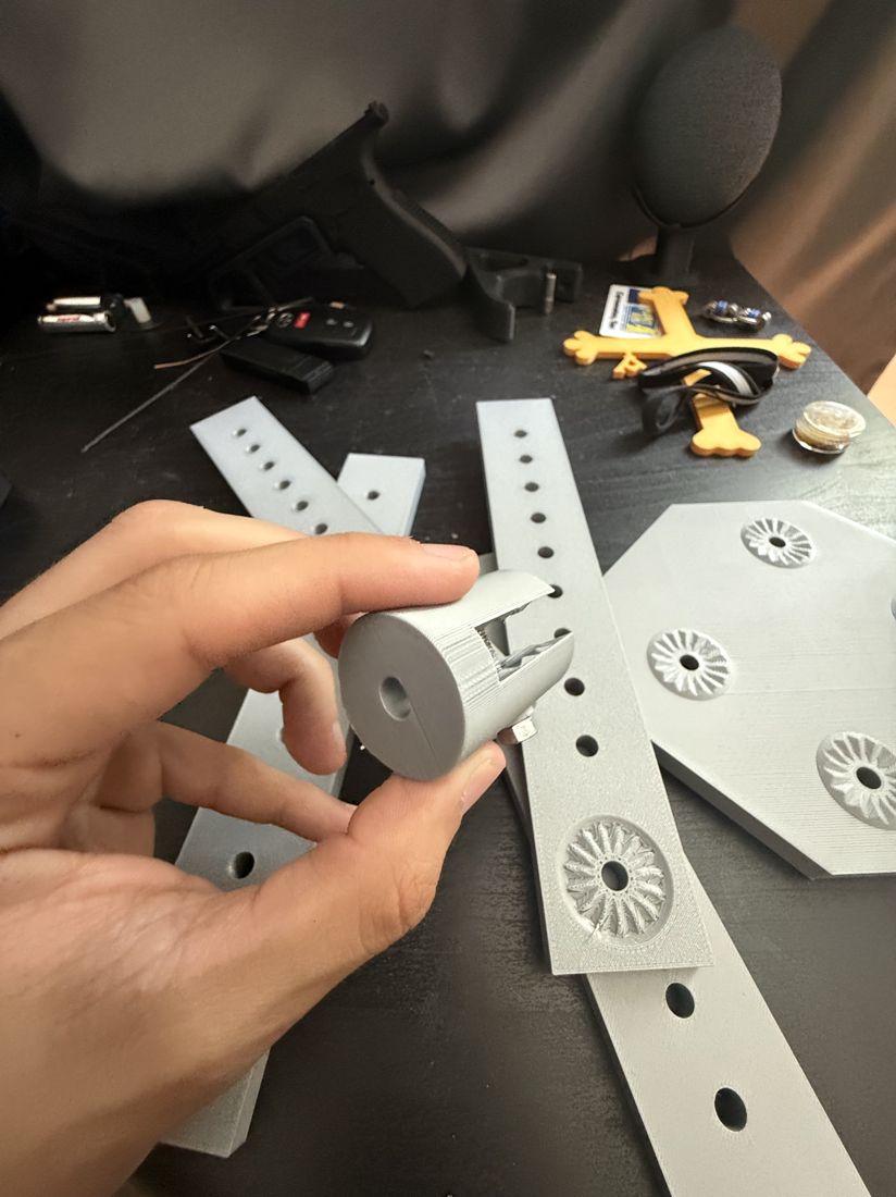 Height-adjust sleeve held up next to perforated rails and rosette-tooth plates