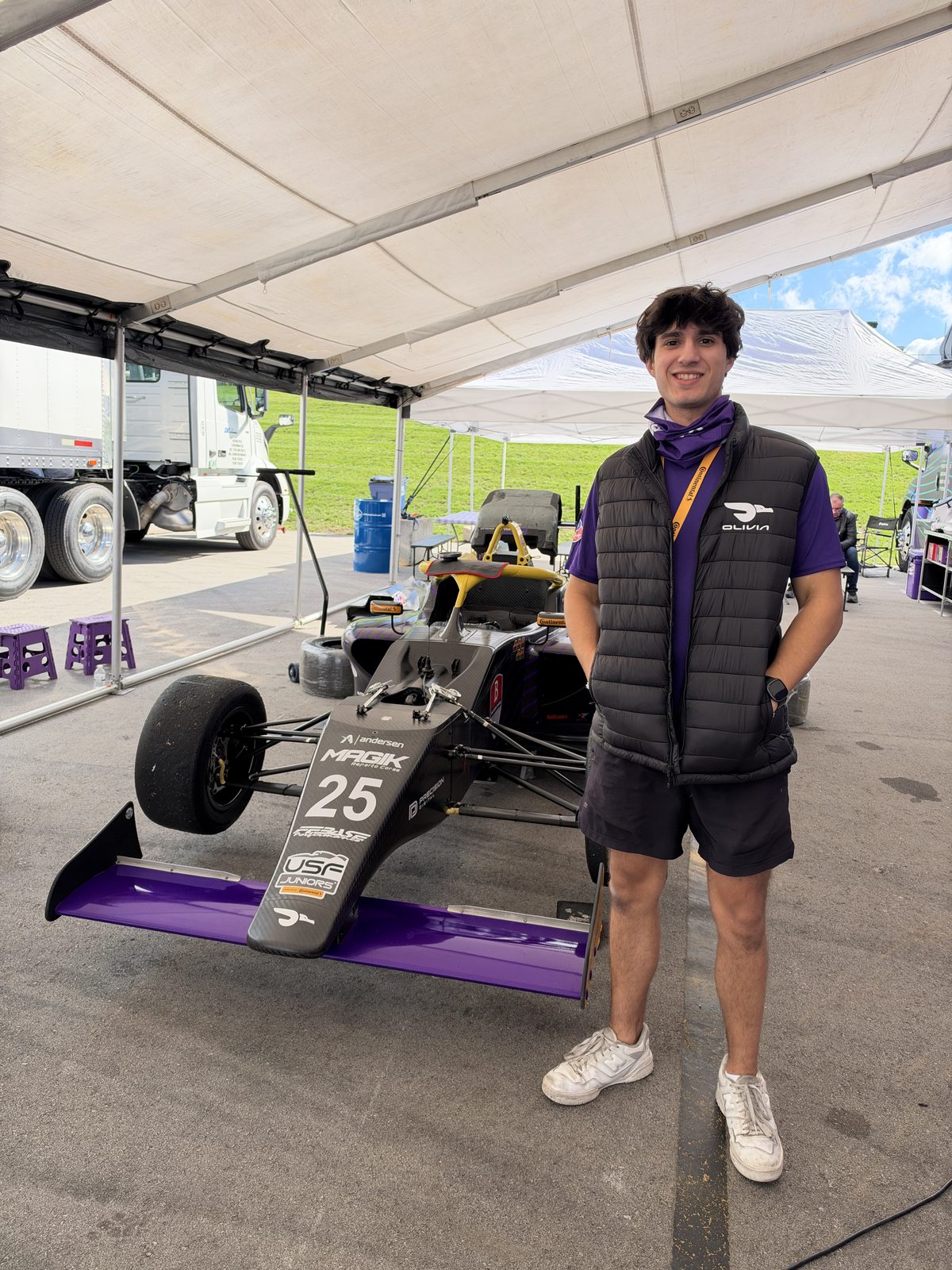 In the paddock next to the car