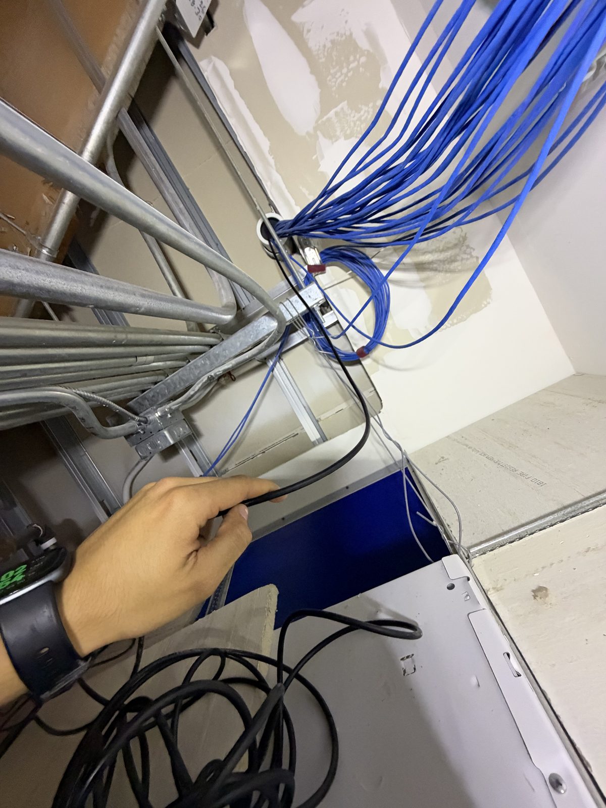 Network cable bundle in a wall cavity